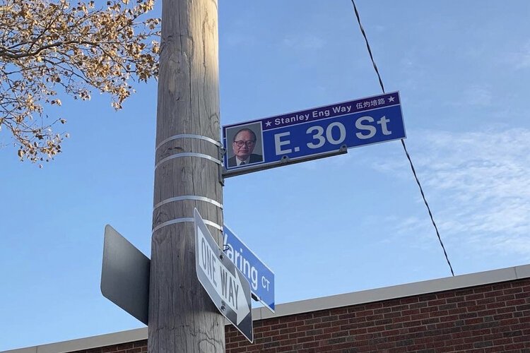 <span class="content-image-text">Stanley Eng Way sign in Asia Town</span>