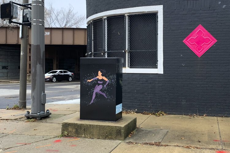 The utility box wrap at Payne Avenue and East 40th Street, titled “Swimming” by Julia Kuo.