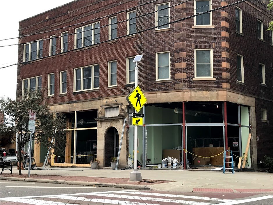 Construction workers hammer away in October on the new home of the UNBar Café.