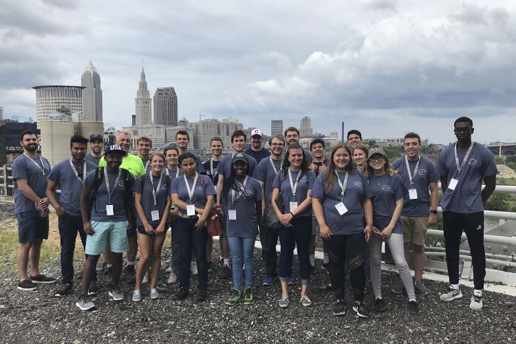 (i)Cleveland students volunteering on the Red Line Greenway