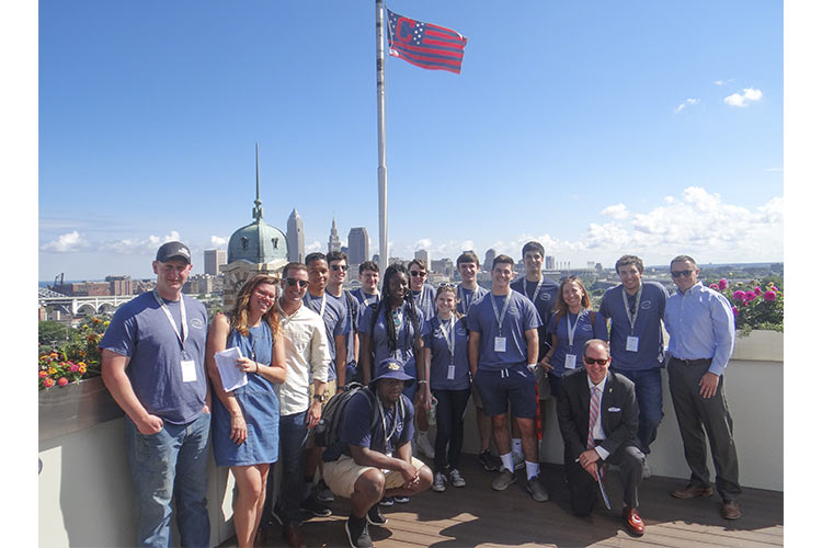 (i)Cleveland students with council member Kerry McCormack on the rooftop of Skyline Financial