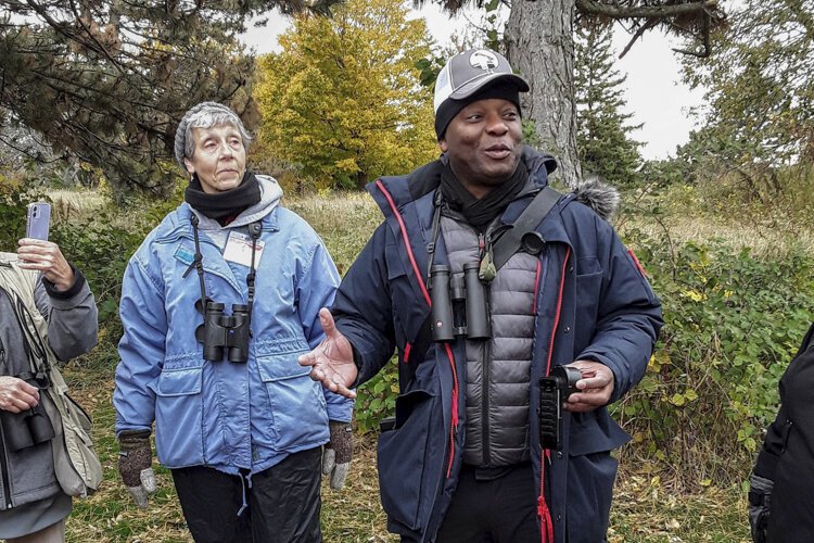 David Lindo talks to the Cleveland Lakefront Tour birders at Cleveland Lakefront Nature Preserve.