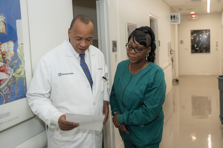 Dr. Charles Modlin discusses a patient file at the Minority Men’s Health Center at the Cleveland Clinic.