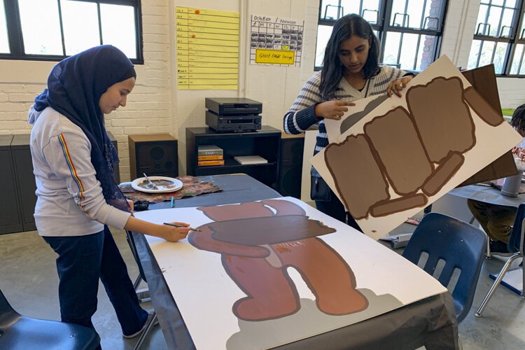Students at Menlo Park Academy make signage this year for the Giant Eagle Market District store in Strongsville.