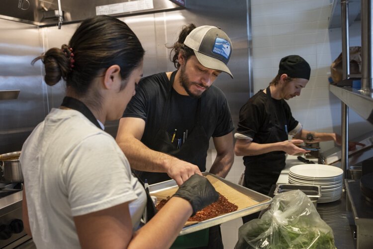 Chef Andrew Mansour (center) says that after extensive research, including a trip to Israel, the team developed a menu that combines a variety of flavors.