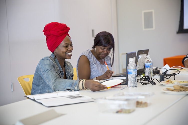 Lauren Harrison (left) and Angela Thomas compare notes at PNC Fairfax Connection.