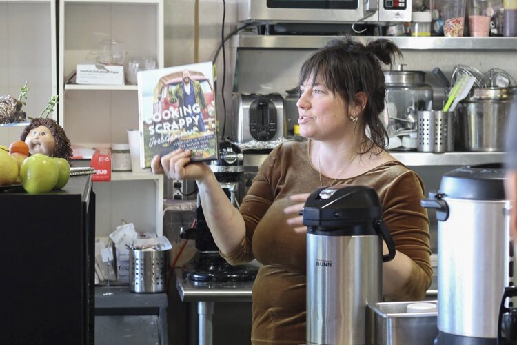Erica Chaffin gives a Slow Food presentation at Baba Yaga in Larchmere.