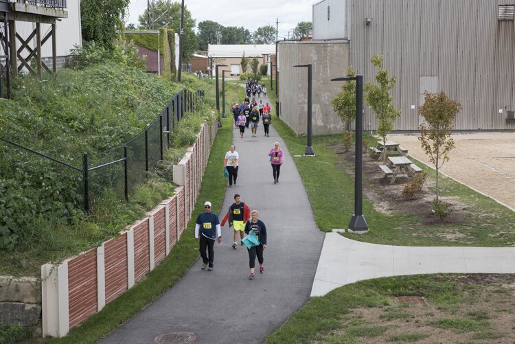 The Cleveland Foundation Centennial Lake Link Trail follows 1.3 miles of abandoned railroad right of way in the Flats.