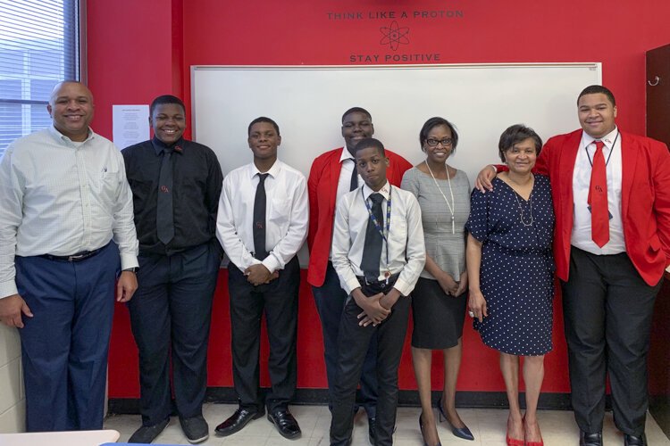 Grady Burrows (left) pictured with young men from Ginn Academy who participated in the community classroom, State Senator Sandra Williams, and Ginn Academy administrator Hazel Parker.