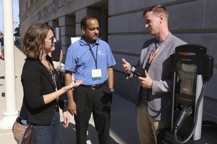 Anand Natarajan, center, energy manager of the Mayor’s Office of Sustainability of the city of Cleveland.