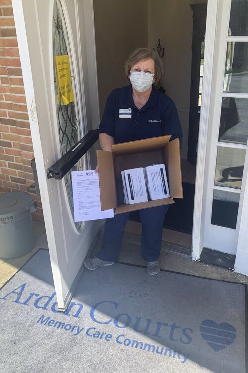 Arden Courts receiving their mask donations from Pulsar.