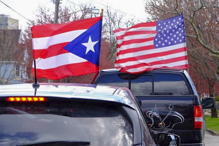 <span class="content-image-text">A caravan of cars drives through the Clark-Fulton neighborhood in Cleveland several months ago in an attempt to get the local Hispanic community registered to vote and counted in the Census.</span>