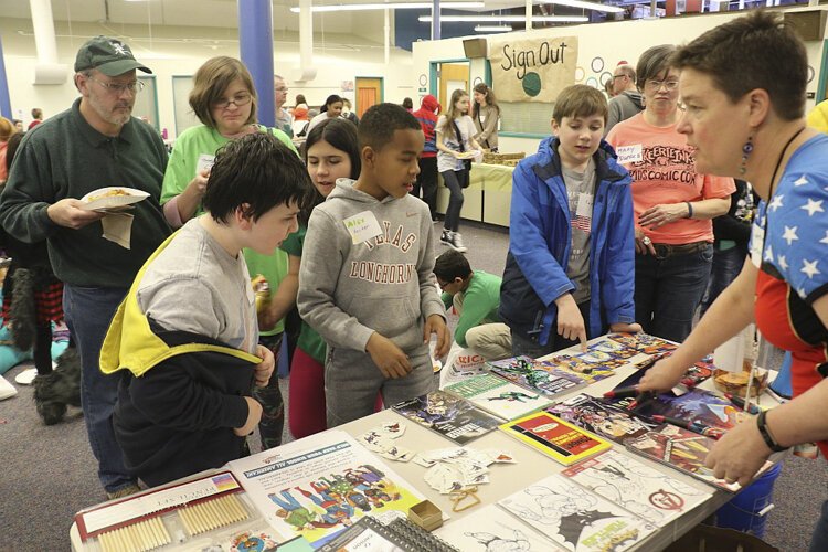 Lake Erie Ink co-founder Cynthia Larsen, far right, answers questions at Kids’ Comic Con.