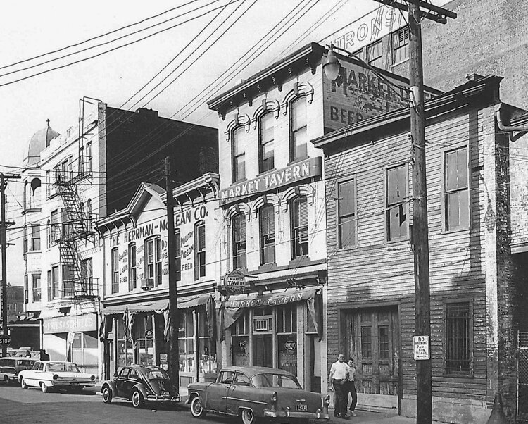 <span class="content-image-text">The three original buildings, shown here in 1963, were fused together when the Conways first began designing the Great Lakes Brewing space.</span>