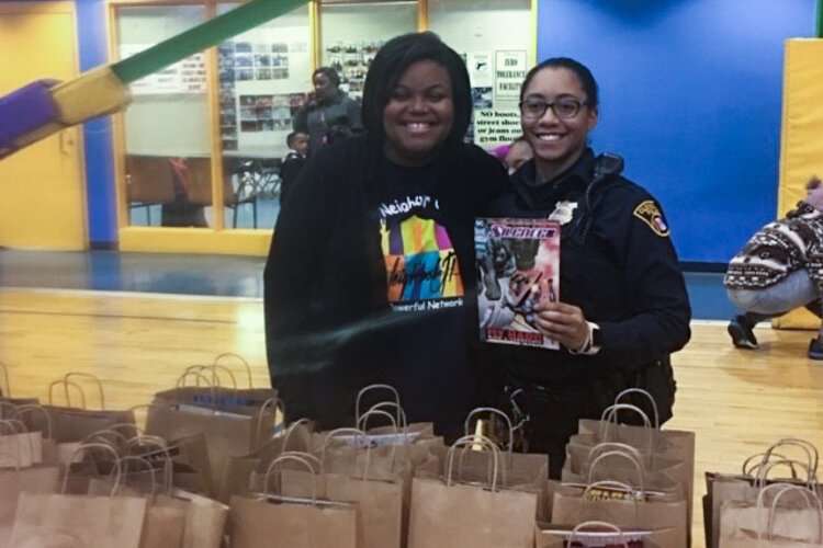 Arrington distributes books at 2018's Big City Boo event, a fun alternative to trick-or-treating.