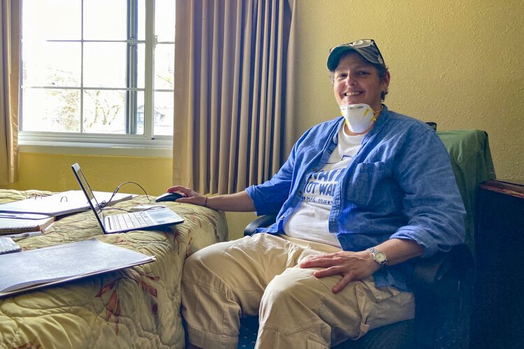 <span class="content-image-text">Catholic Worker Paula Miller coordinates hospitality and outreach efforts from her hotel room office for about 50 unsheltered people staying at the hotel for Northeast Ohio Coalition for the Homeless.</span>