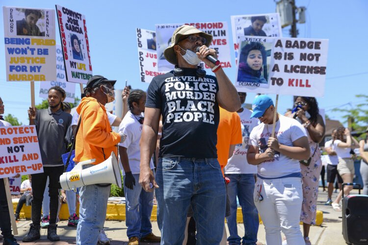 Desmond Franklin protests outside the Cleveland Police Second District Precinct.