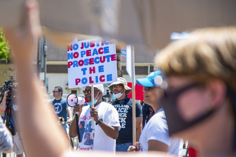 Desmond Franklin protests outside the Cleveland Police Second District Precinct.