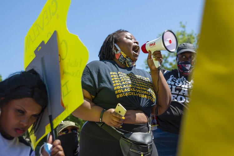 Desmond Franklin protests outside the Cleveland Police Second District Precinct.
