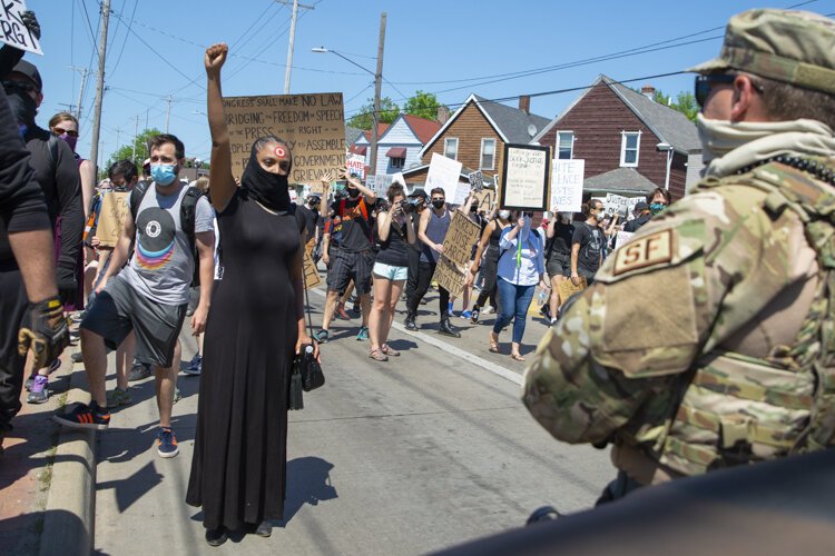 <span class="content-image-text">Desmond Franklin protests outside the Cleveland Police Second District Precinct.</span>