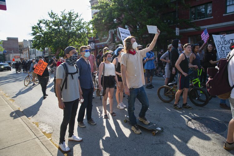 Desmond Franklin protests outside the Cleveland Police Second District Precinct.