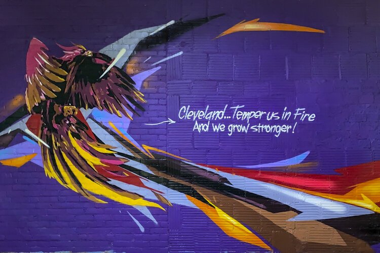 Temper Us in Fire, is the newest mural created by artists Bob Peck and R!ch Cihlar who paint together under the name “Don’t Panic!”.