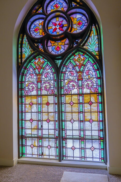 Bell tower bedroom church window in the San Sofia Luxury Apartments.