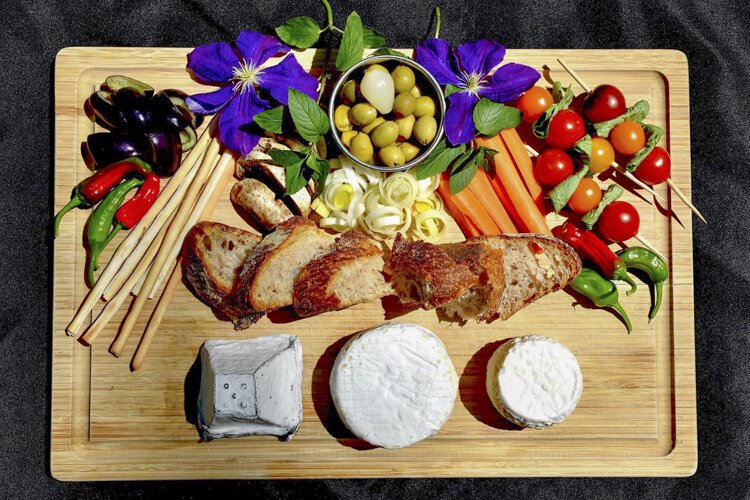 Midweek cheese board, featuring Marchant Manor Beachy Head Goat, Lapworth Porcini Camembert, and Henley Triple Cream cheeses.