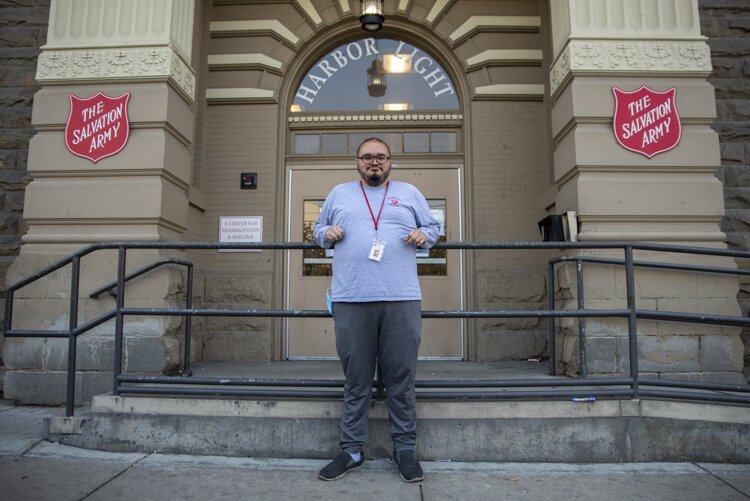 Wilber Argueta stands outside the Zelma George Salvation Army Shelter, where he helped organize online tutoring for 12 homeless youth this summer.