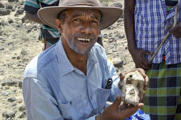 Yohannes Haile-Selassie in Ethiopia with a piece of MRD's cranium