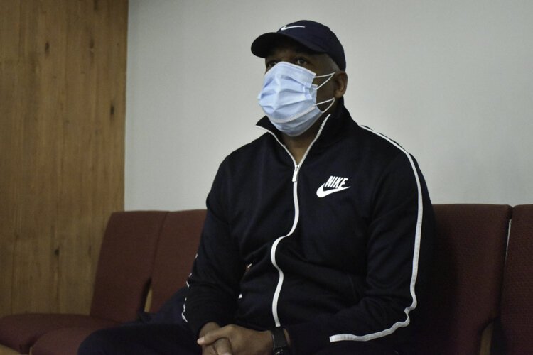 Andre Cisco, a Bedford Heights resident, pauses for a moment on a bench after getting his second dose of the vaccine at a clinic at his church, Affinity Missionary Baptist Church.