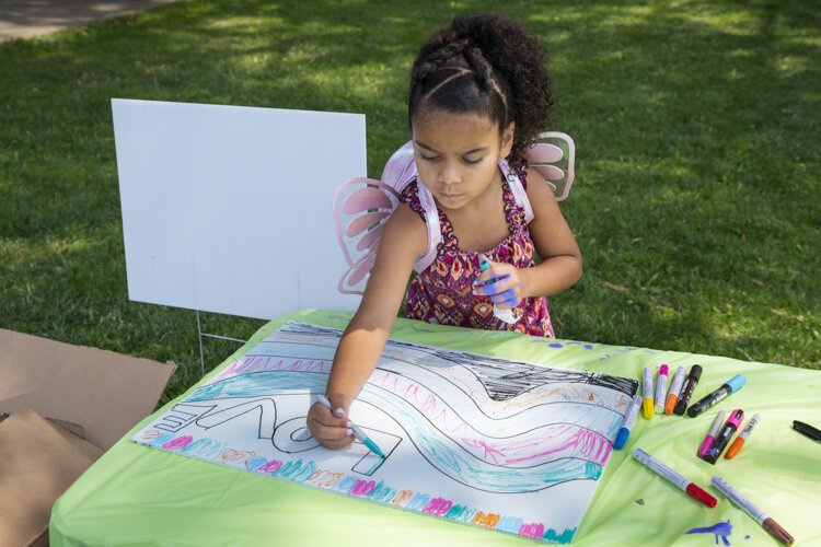 Yard Sign Art with Metro Health at ¡Celebramos! at Roberto Clemente Park