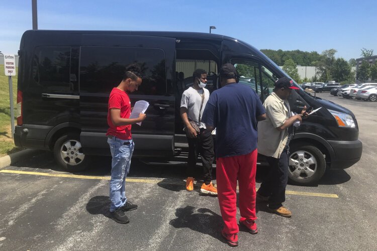 Church van program workers disembark at General Die Casters