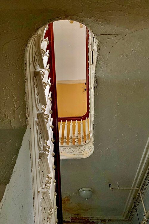 The staircase leading up to the second floor of the Cook-Bousfield mansion.
