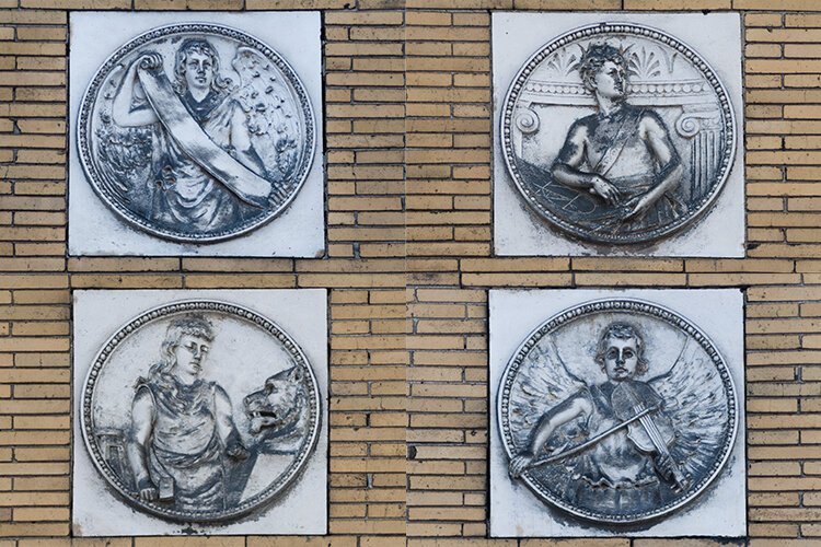 Relief sculptures on the exterior of the Olney Gallery.