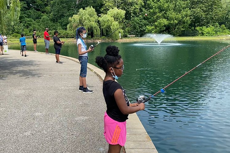 <span class="content-image-text">Organic Connects feels that nature helps urban youth escape everyday stressors like these kids fishing at Rockefeller Park.</span>