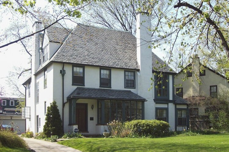 Designed in a French Eclectic style, the home at 3280 Maynard employed the use of stuccoed and painted masonry walls, large chimneys, and a steeply pitched roof.