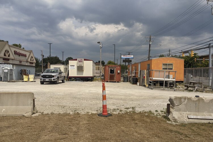 Where the job trailers are located next to the Walgreens is the future location of a commercial development.
