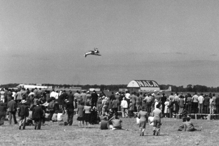 Spectators watch aerobatic maneuvers at the Cleveland National Air Races in 1946.