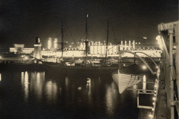 Admiral Byrd's South Pole Ship docked at the Great Lakes Exposition with the Firestone building and Hall of Progress in the background