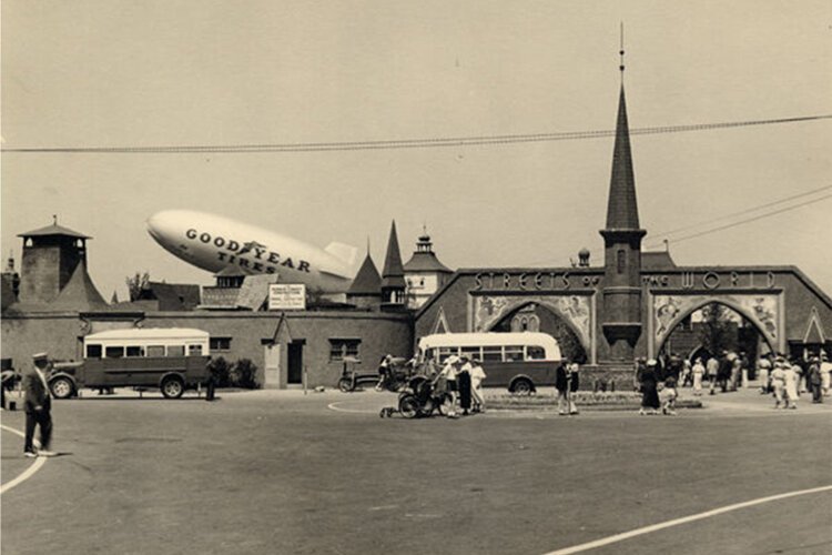 <span class="content-image-text">Streets of the World exhibit at the Great Lakes Exposition, with the Goodyear blimp in the background</span>