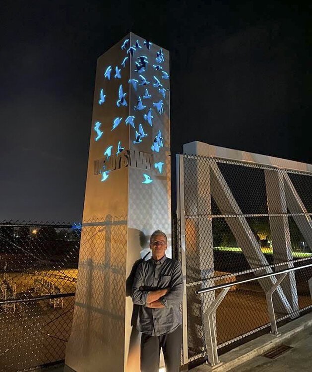 <span class="content-image-text">Artist Stephen Yusko next to one of the sculptures he created with Stephen Manka for the Wendy's Way pedestrian bridge. Photo by Kenneth Knabe.</span>