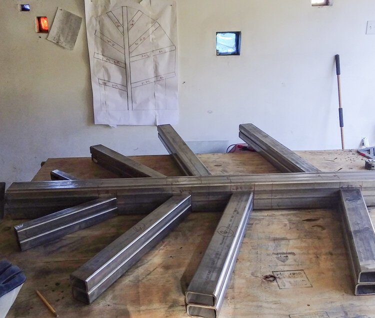Erik Neff laid out the steel structure pieces before welding.