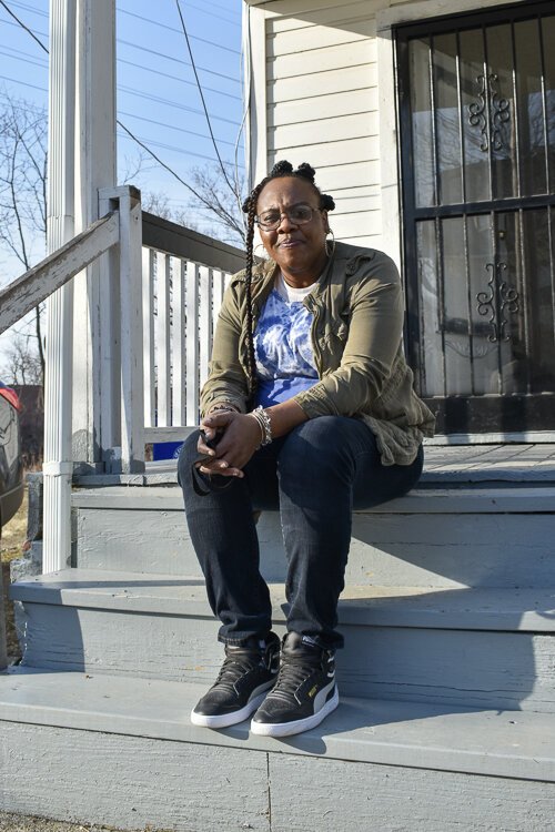 <span class="content-image-text">Denesha Moses sits on her porch in the Buckeye-Woodhill neighborhood. Moses received help from the Cleveland right to counsel program last year after her former landlord filed an eviction against her.</span>