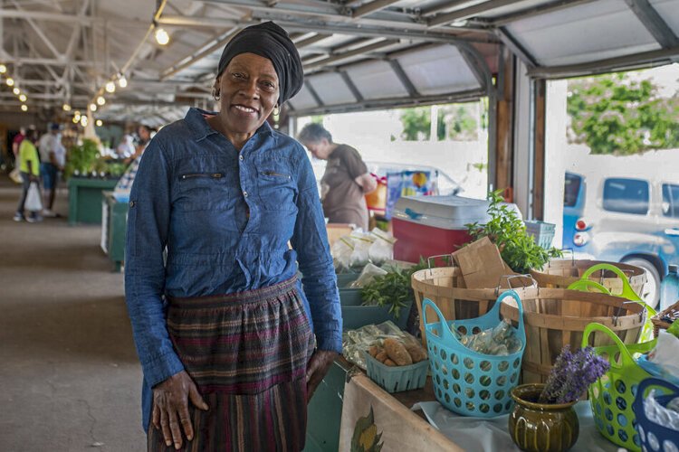 <span class="content-image-text">Gloria Jalil, a vendor at Coit Road Farmers Market, has been selling produce from her garden since 2008. Many of Jalil’s customers use their EBT card to purchase vegetables from her stand.</span>