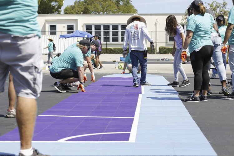 Example of the court tiles being installed on a similar court in a different city.