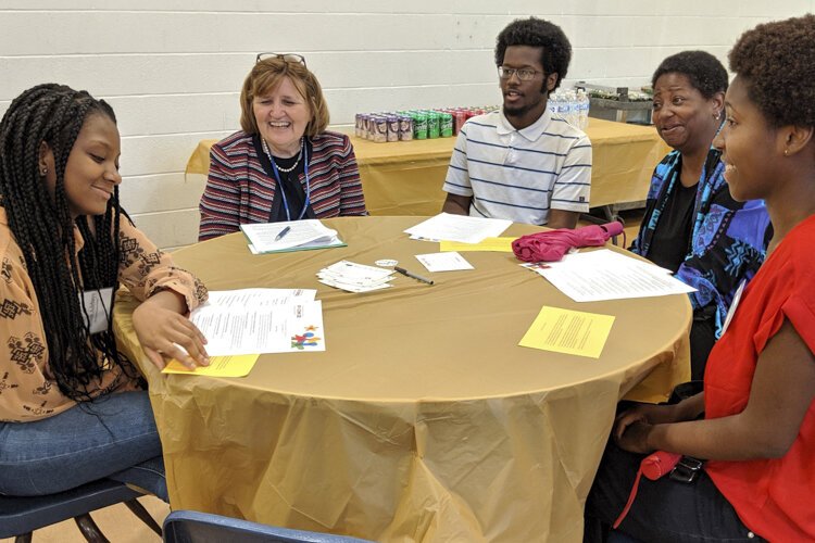 Sue at College Roundtable event talking to prospective students/Promise scholars