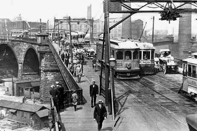 <span class="content-image-text">Streetcars, pedestrians, and private automobiles cross the Superior Viaduct, circa 1910s</span>