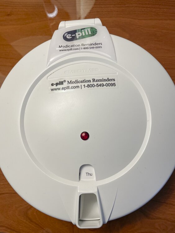Med minder alerts Ben and dispenses medication.