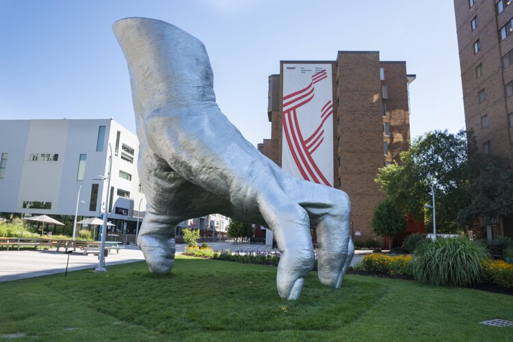 “Judy’s Hand Pavilion” by Tony Tasset consists of a 21-foot-tall hand pressing its thumb into an Uptown plaza.